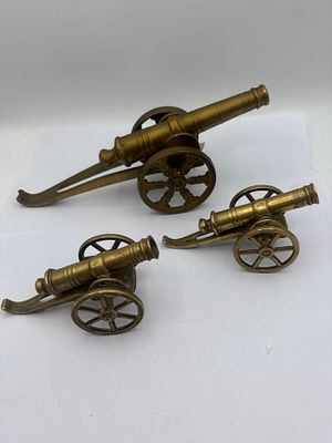Three Vintage Brass Model Field Cannons. A set of three vintage brass model field cannons 