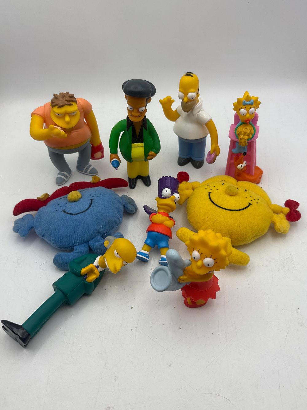 Lot 401: A Collection of Nine Miscellaneous Children's Toys, including The Simpsons Movie Burger King Figurines