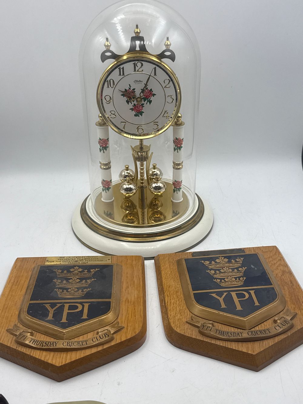 Lot 408: A Kundo Anniversary Dome Clock and A Pair of YPI Thursday Cricket Club Award Plaques