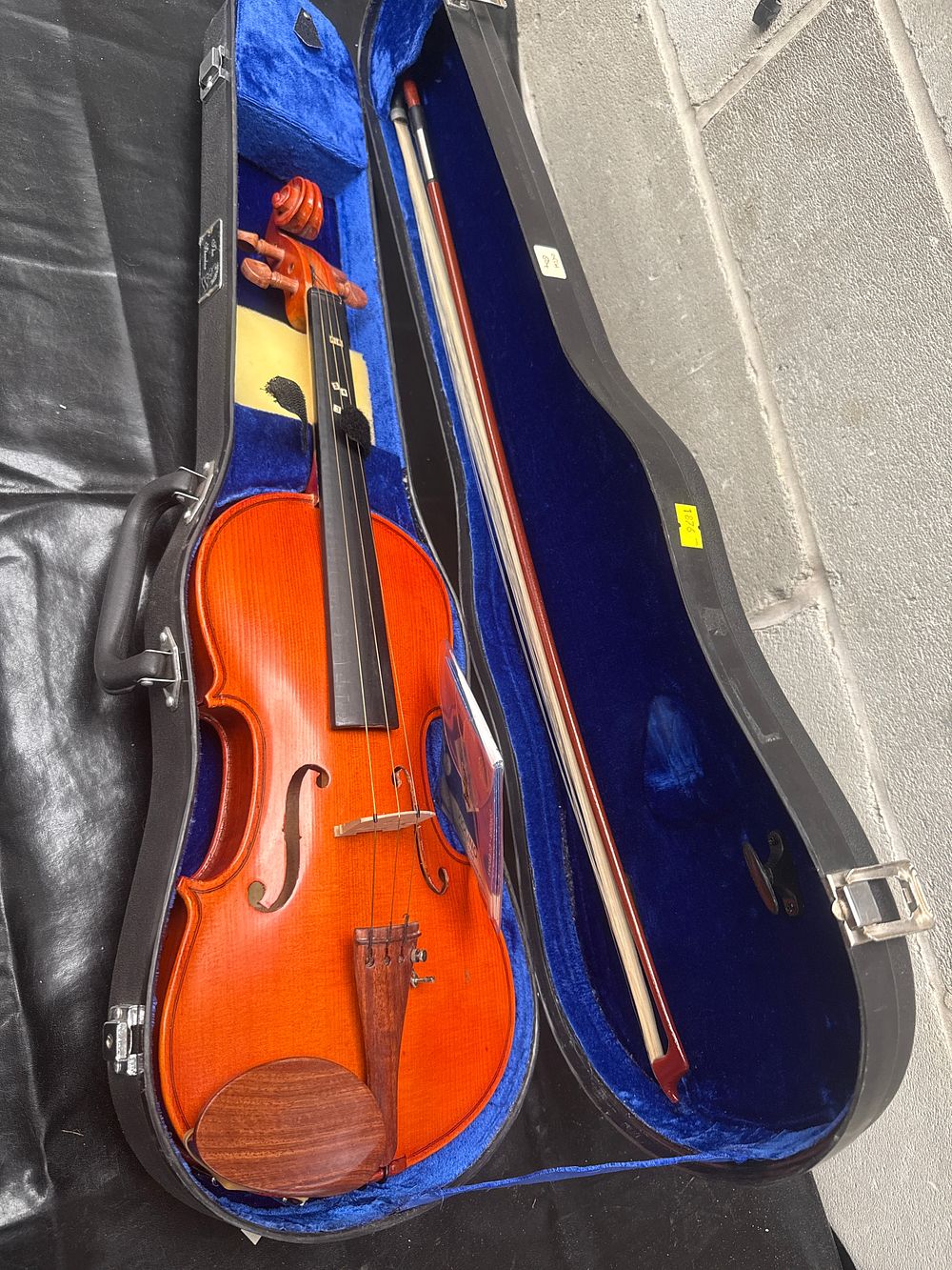 Lot 414: A Child's Classical-Style Wooden Violin with Bow and 'The Stentor' Branded Case
