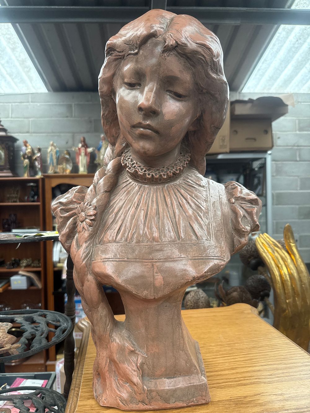 Lot 422: Ricardo Aurilli (Italian, circa 1900), An Art Nouveau Terracotta Bust of a Young Woman