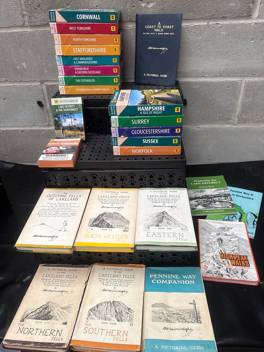 Lot 434: A Collection of British Walking and Cycling Guidebooks, including A. Wainwright's Lakeland Fells Series and AA Regional Guides