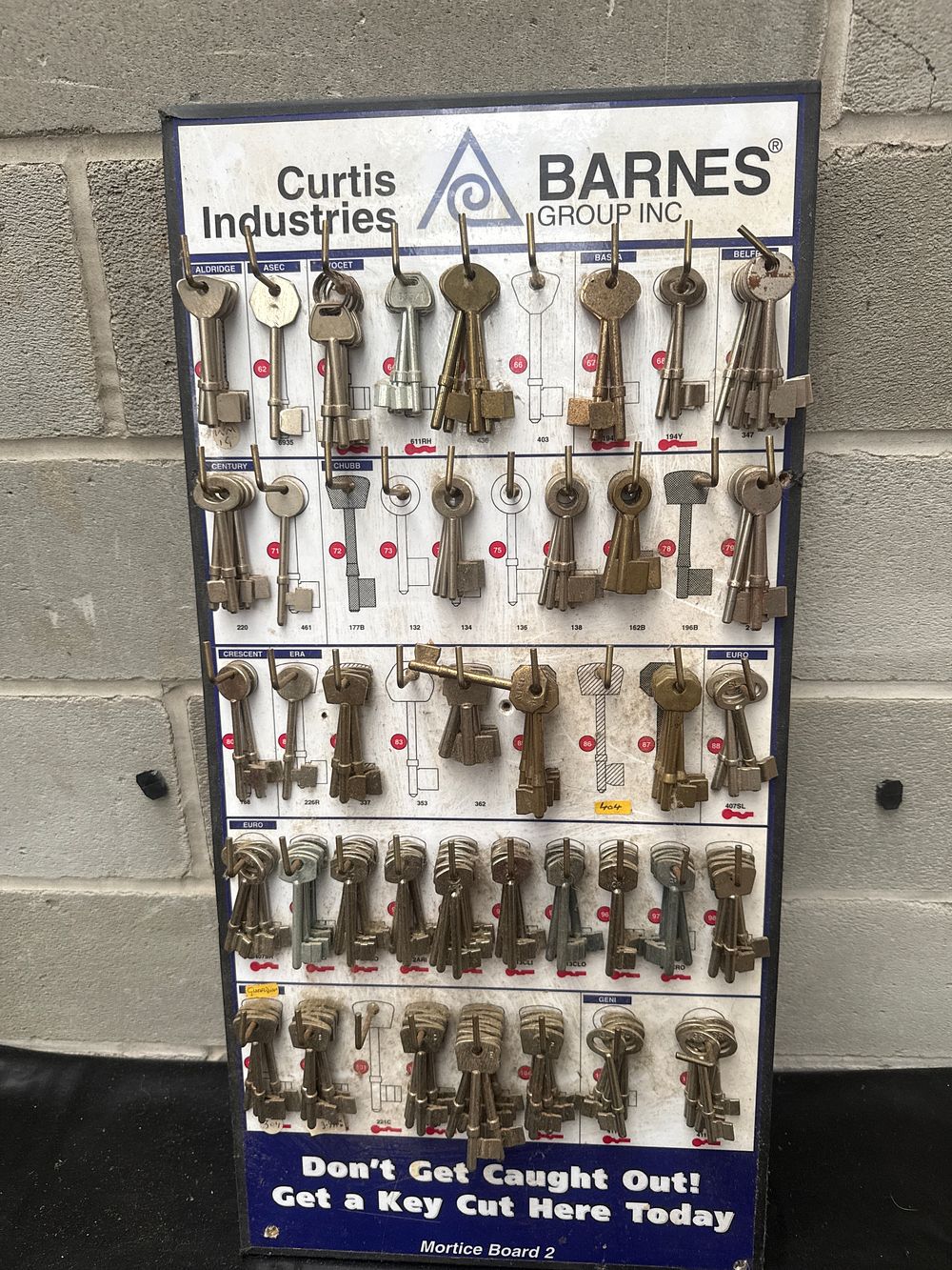 Lot 454: Curtis Industries and Barnes Group Inc. Multi-Tiered Mortice Key Cutting Reference Display Board, 'Mortice Board 2'