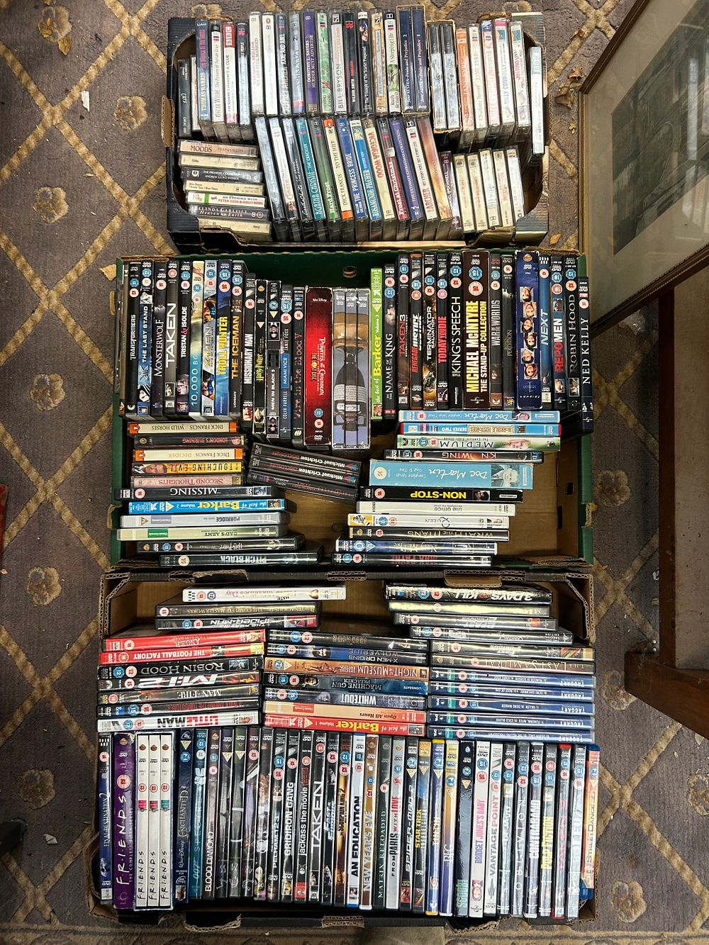 Lot 474: A Large Collection of English-Language Home Video Media, comprising DVDs and VHS Tapes