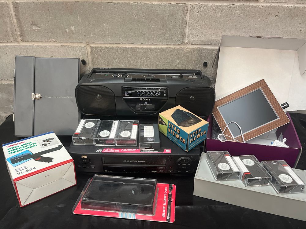 Lot 294: Vintage JVC VCR, SONY Boombox, and Mixed Consumer Electronics Accessory Lot