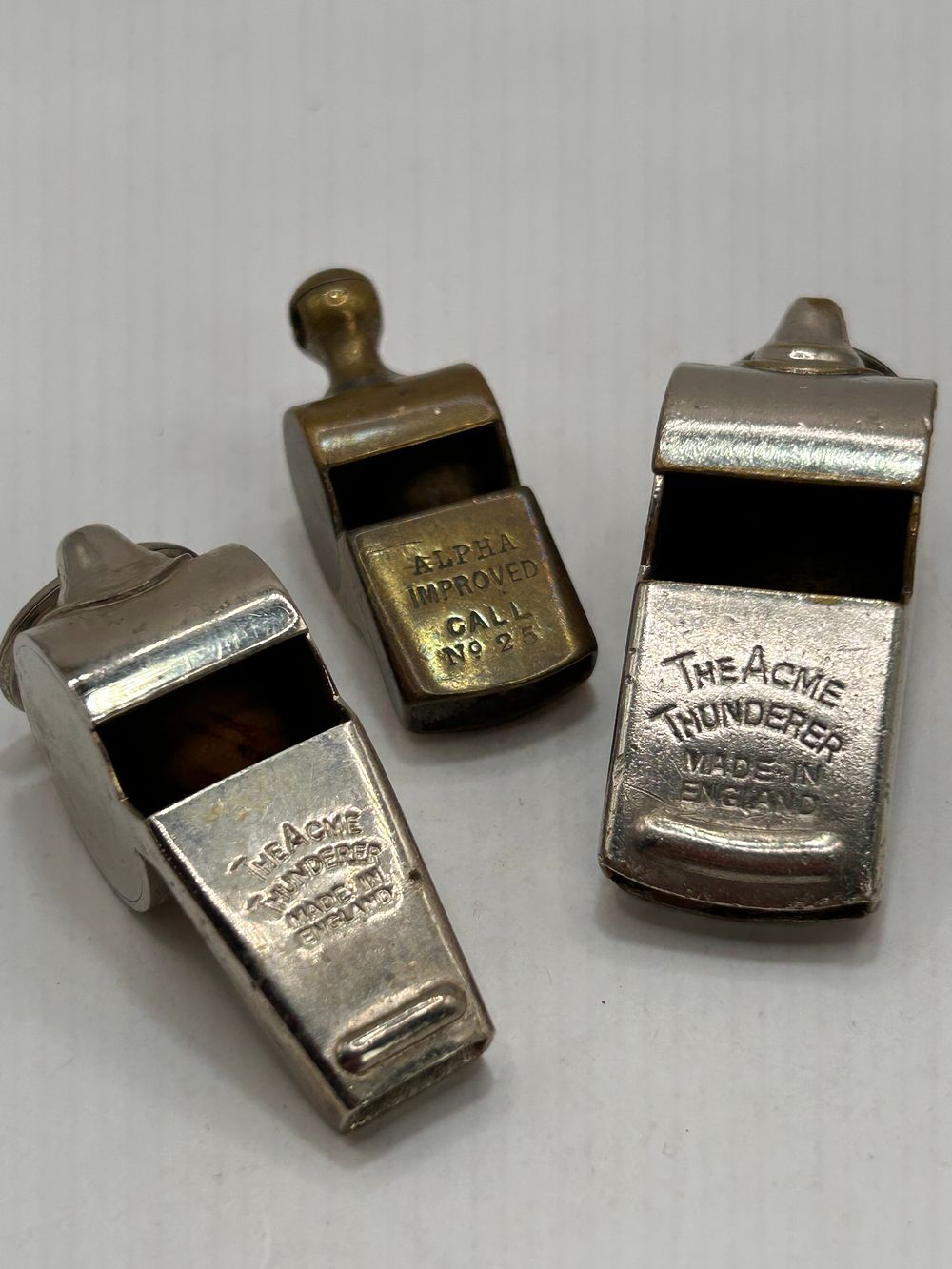 Lot 302: A Trio of Vintage Utility Whistles including Two Acme Thunderer and One Alpha Improved