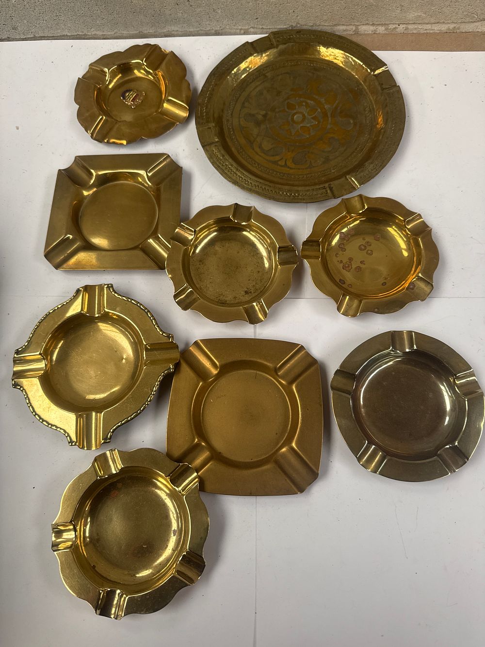 Lot 555: A Collection of Nine Vintage Brass Ashtrays and Utility Trays