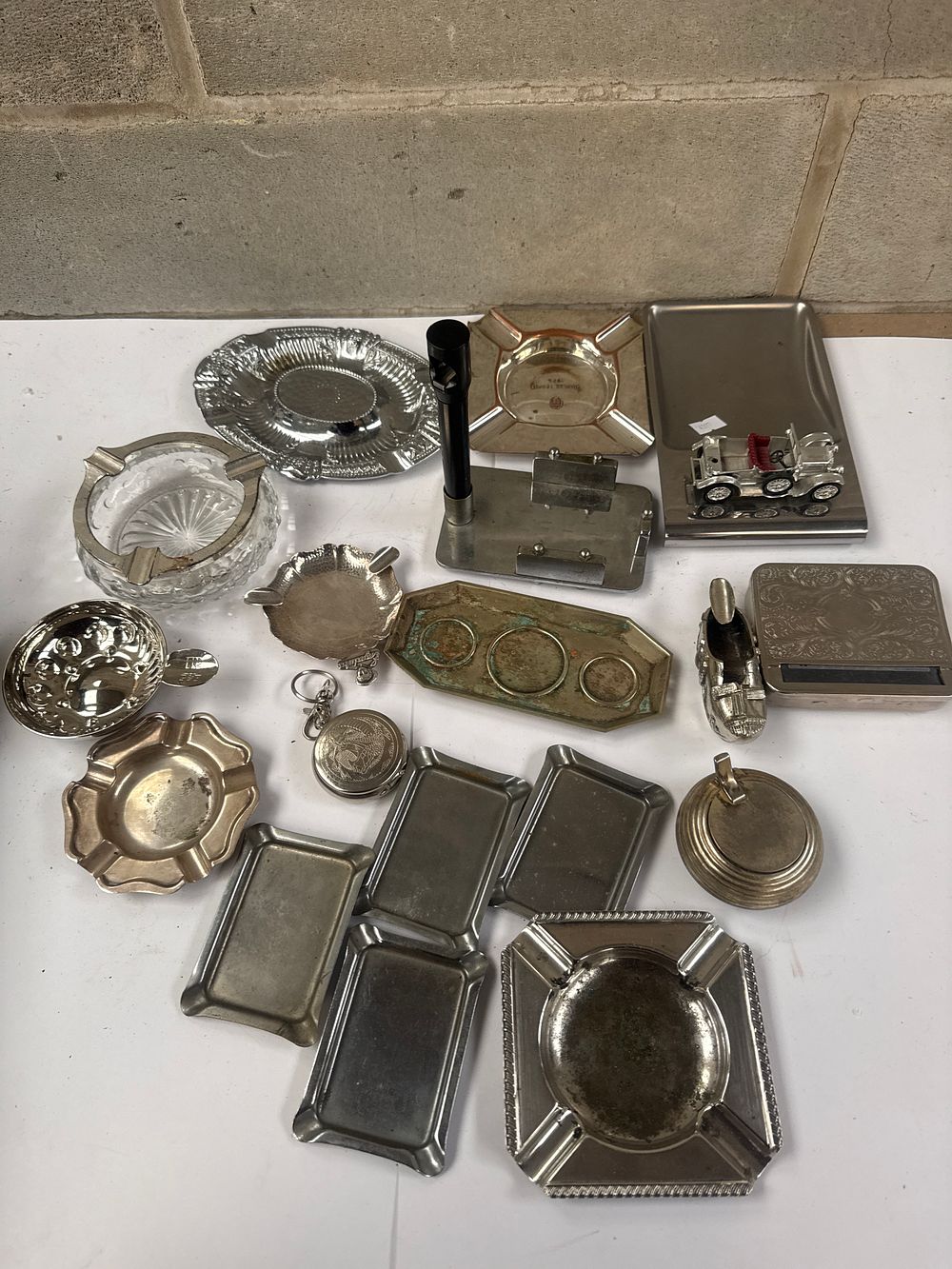 Lot 556: A Collection of  Vintage and Mid-Century Silver-Toned Metal Smoking Accessories and Desk Items