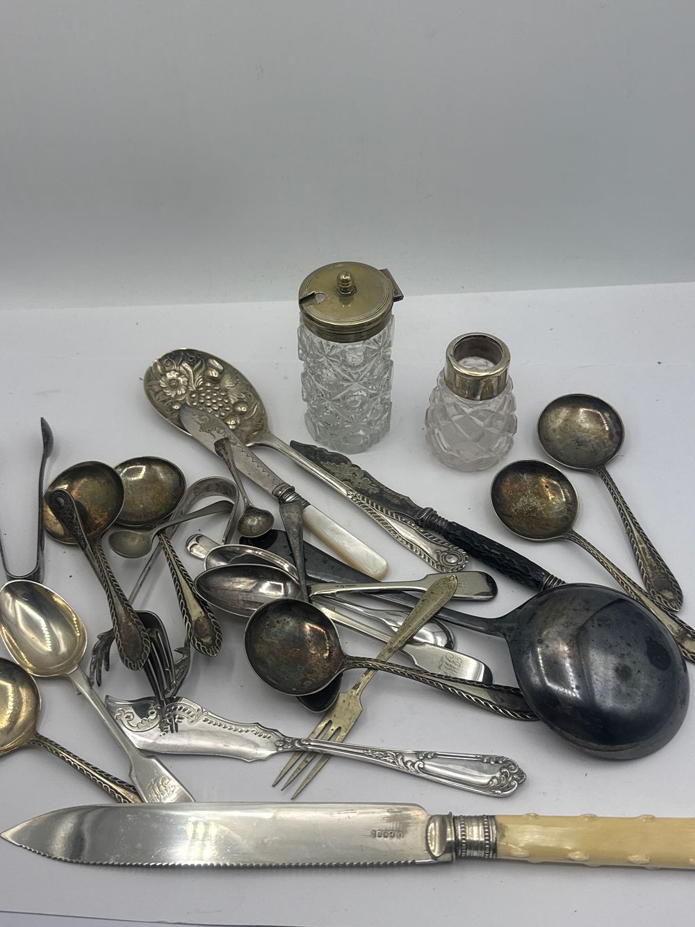 Lot 193: An Assortment of Sterling and Silver-Plated Flatware and Tabletop Accessories
