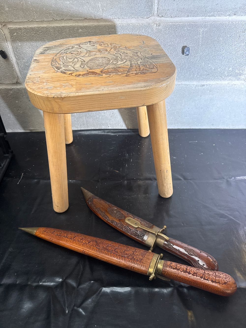 Lot 512: A Trio of Decorative Wooden Items Including an Octopus Motif Stool and a Pair of Indian Daggers