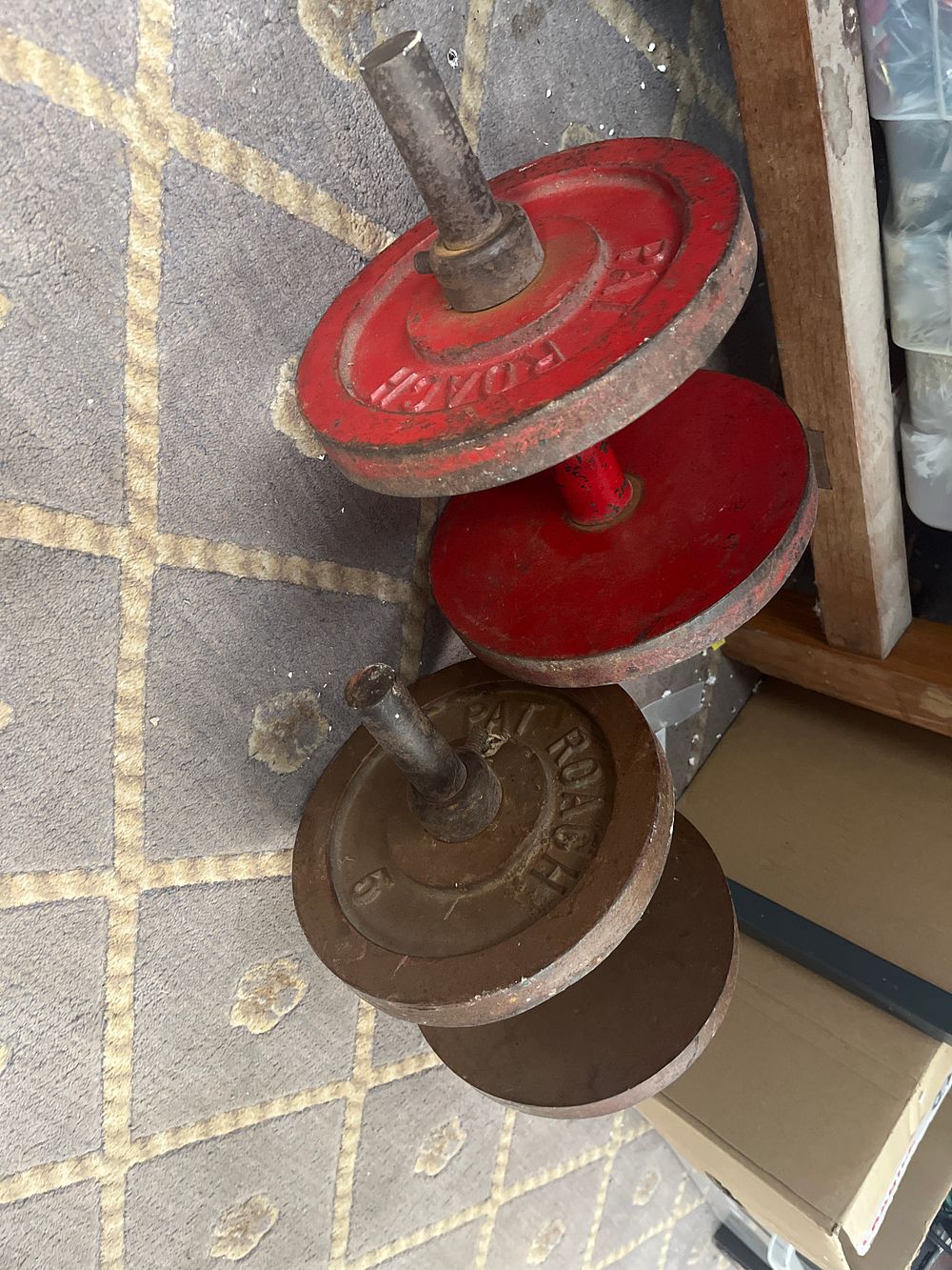 Lot 549: A Pair of Pat Roach Cast Iron Dumbbells