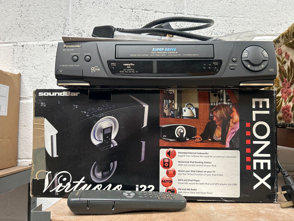 Lot 303: Two Home Electronics Items Comprising a Panasonic NV-SD430 VHS VCR and a Boxed Elonex Virtuoso i22 Soundbar