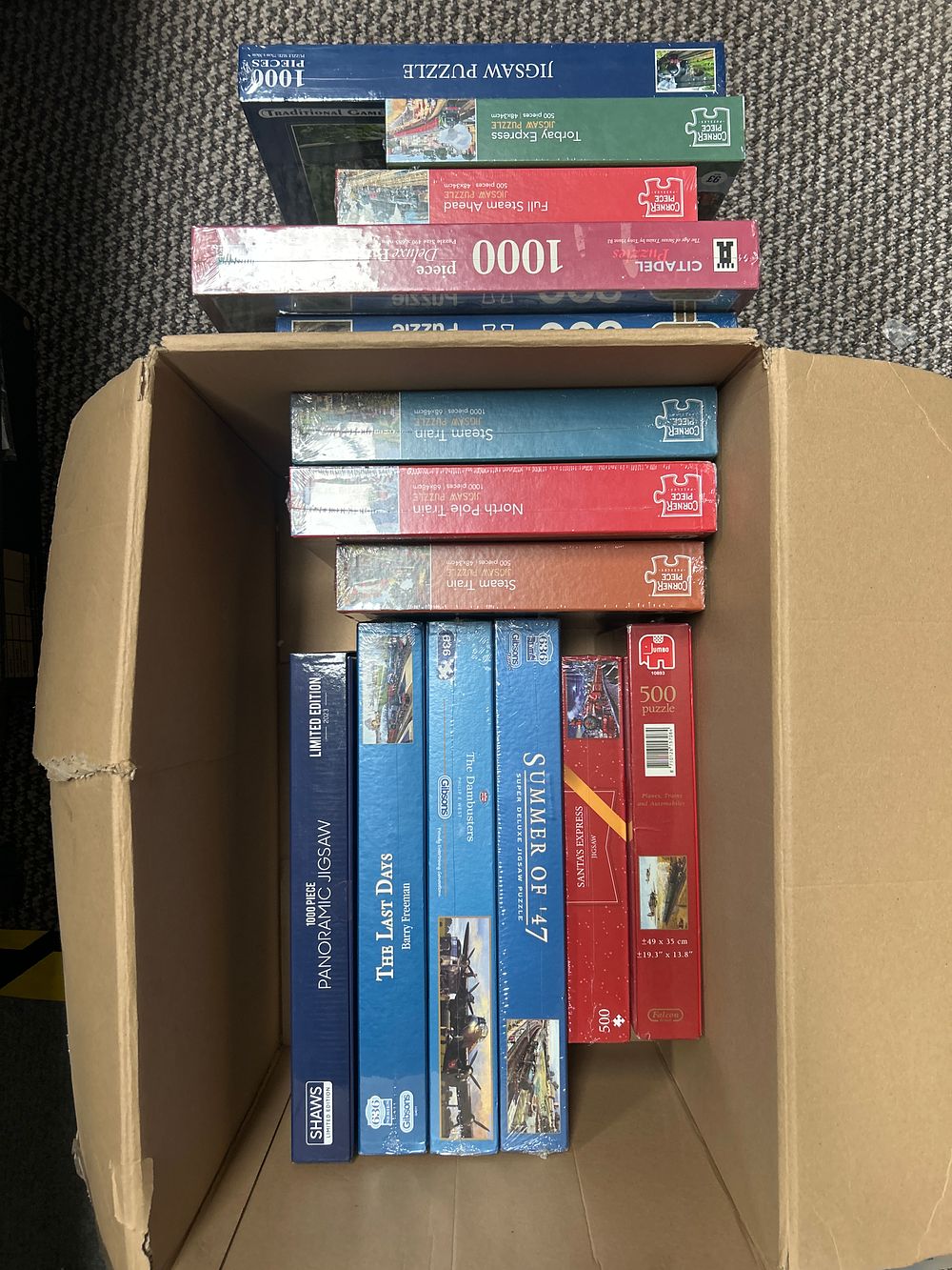 Lot 305: A Collection of New and Boxed Jigsaw Puzzles Including Gibsons, Falcon, and Corner Piece