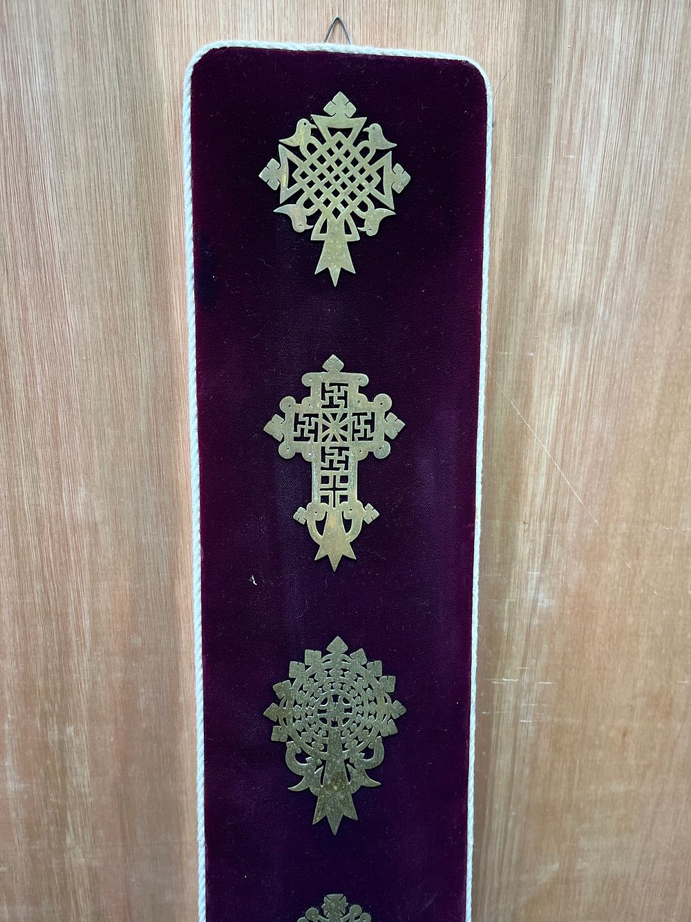 Lot 325: A Collection of Ethiopian Coptic Christian Metal Crosses on Velvet Wall Banner