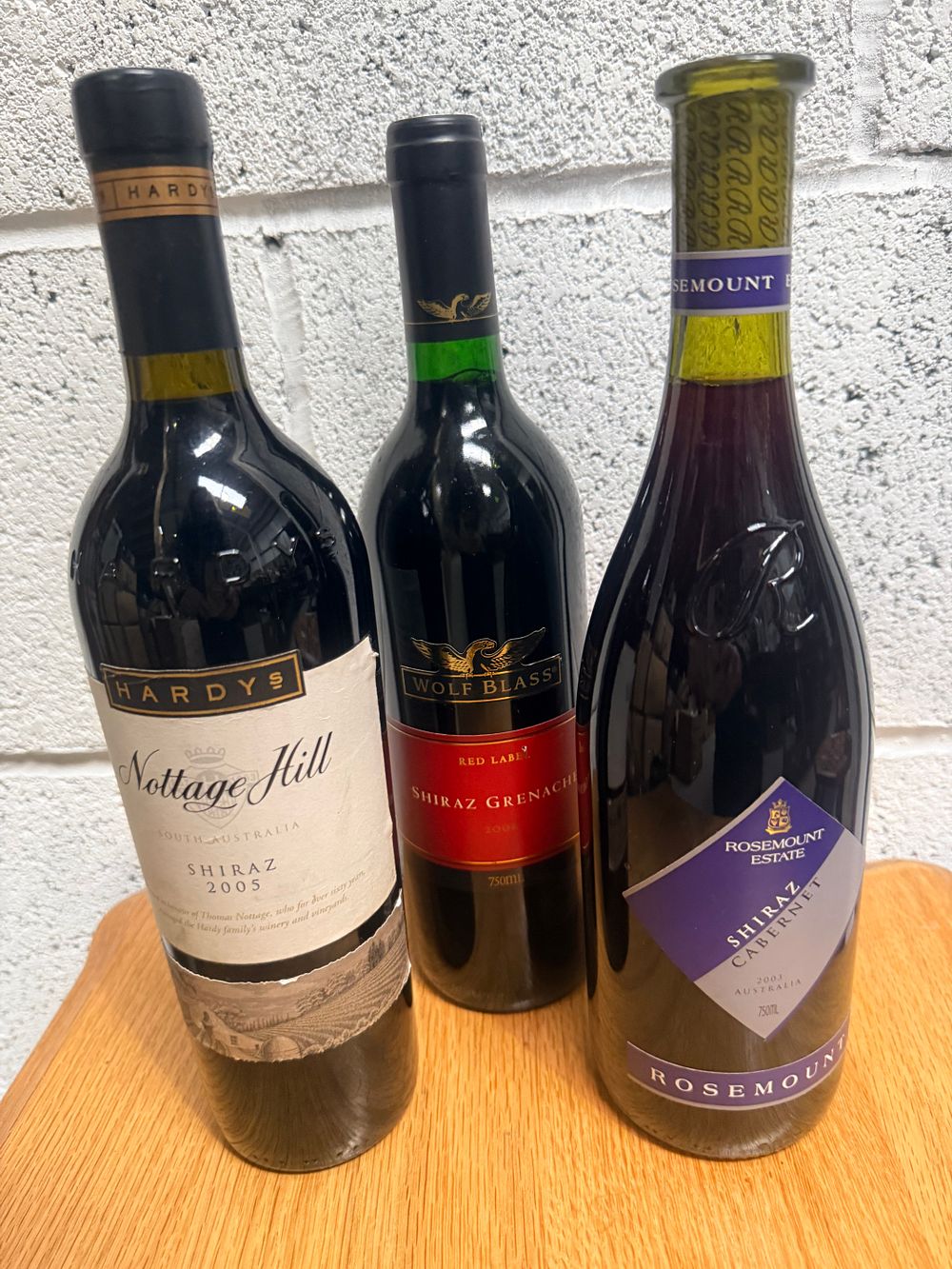 Lot 343: Three Bottles of Australian Red Wine including Rosemount Estate, Wolf Blass, and Hardys