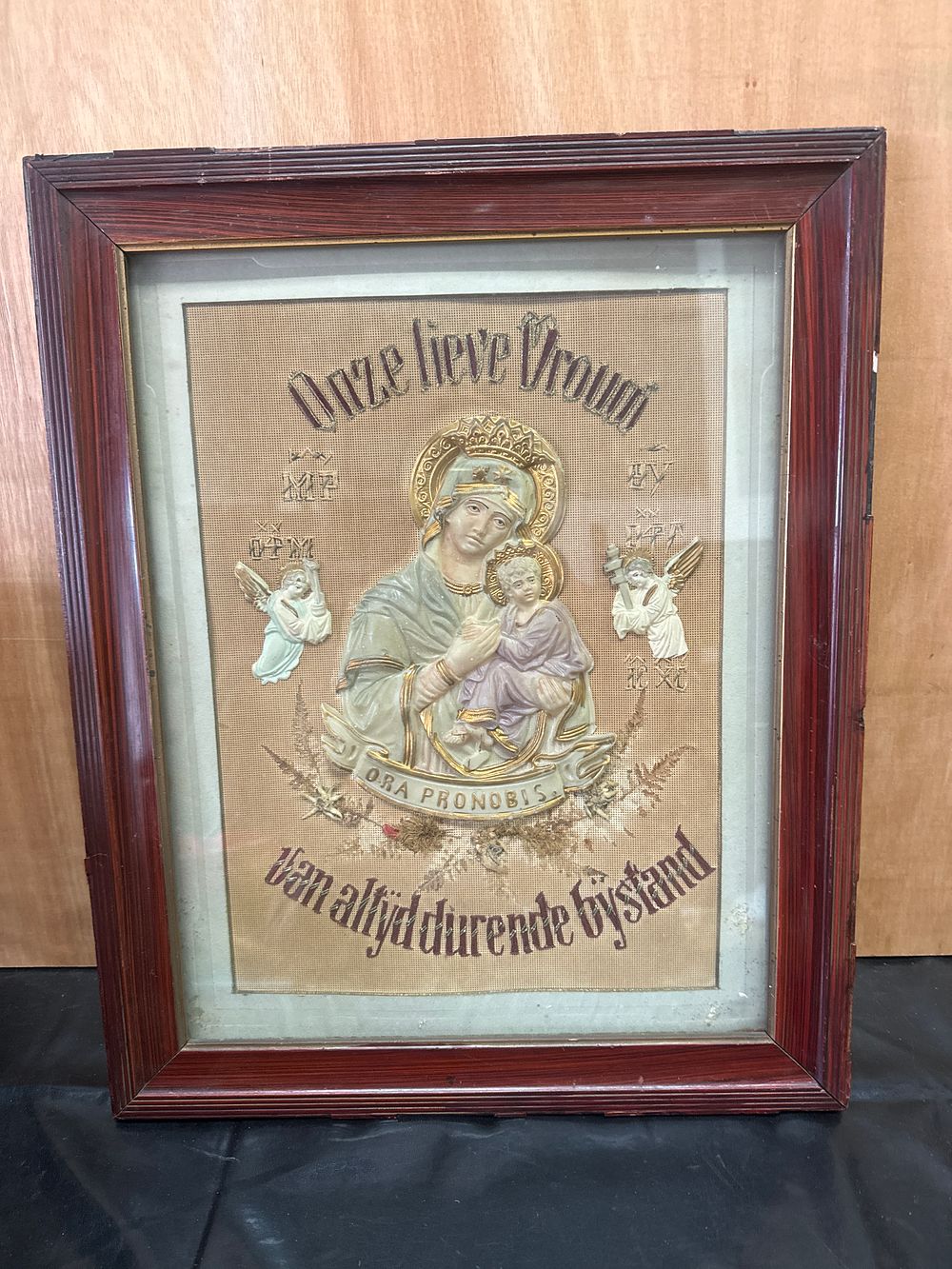 Lot 386: A Framed Polychrome Relief of Our Lady of Perpetual Help with Dutch Inscription, 17 x 21 Inches