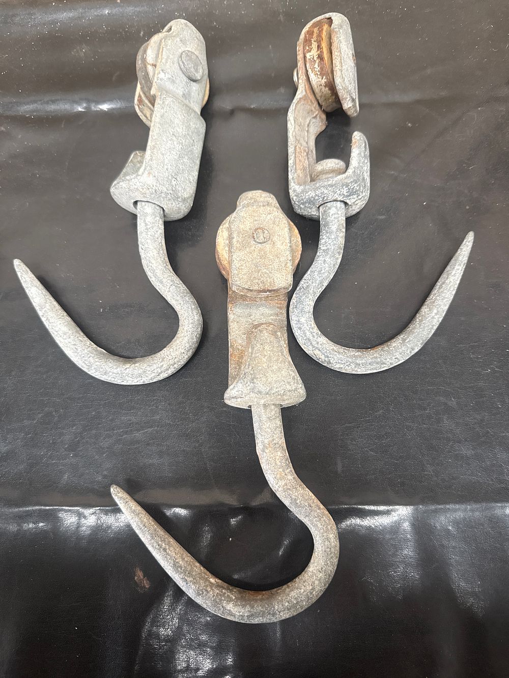 Lot 402: A Trio of Antique Primitive Industrial Cast Iron Pulley / Butchers Hooks
