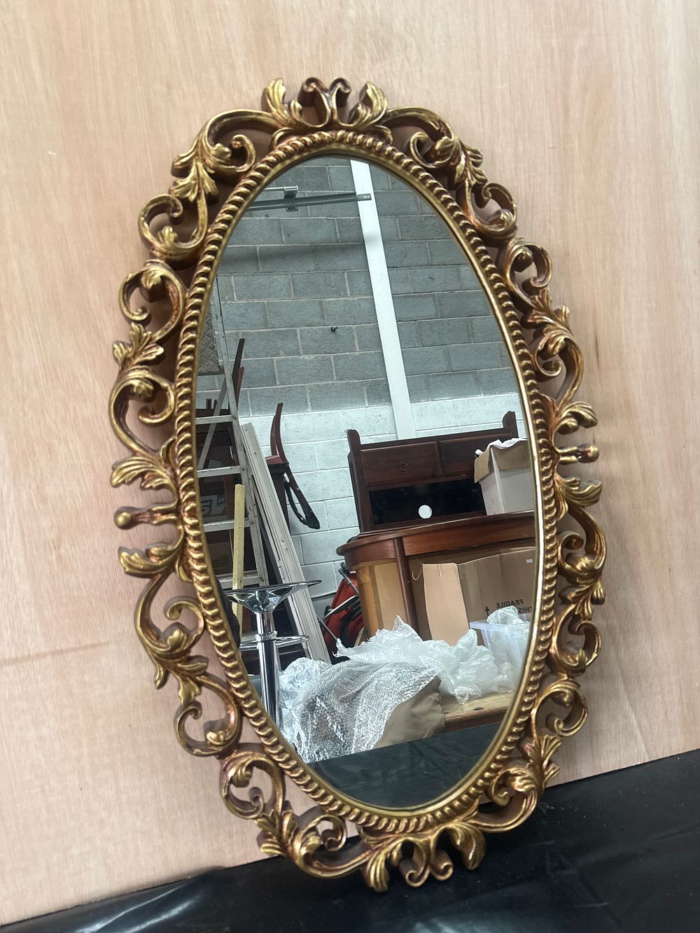 Lot 410: A Baroque Style Gilt Finished Oval Wall Mirror 18 X 28 Inches