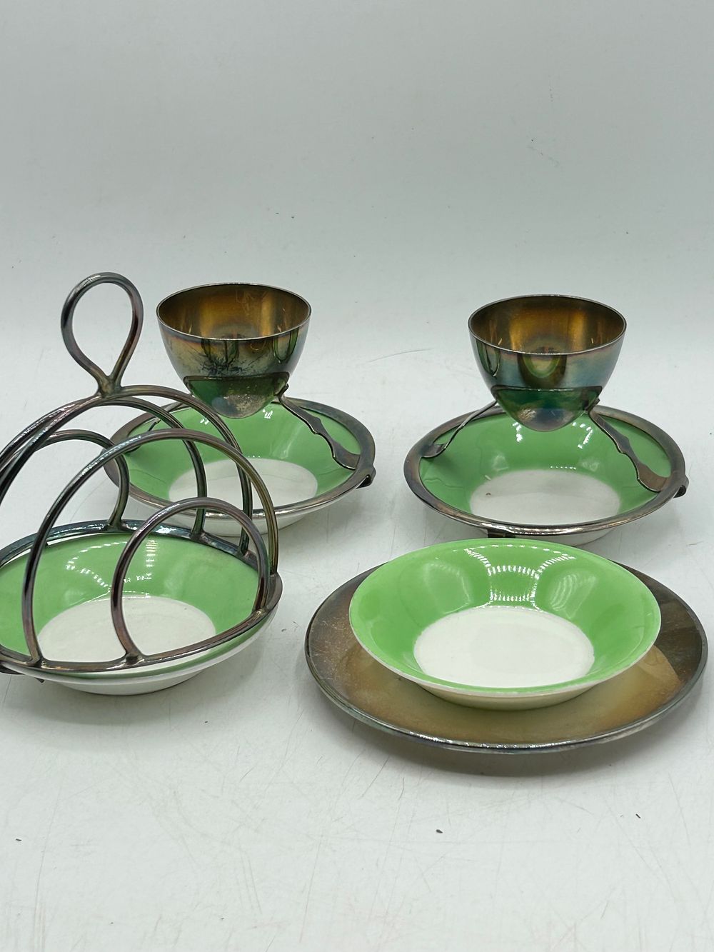 Lot 428: A Group of Hukin and Heath / Dresser Silver-Plated and Ceramic Breakfast Service Items