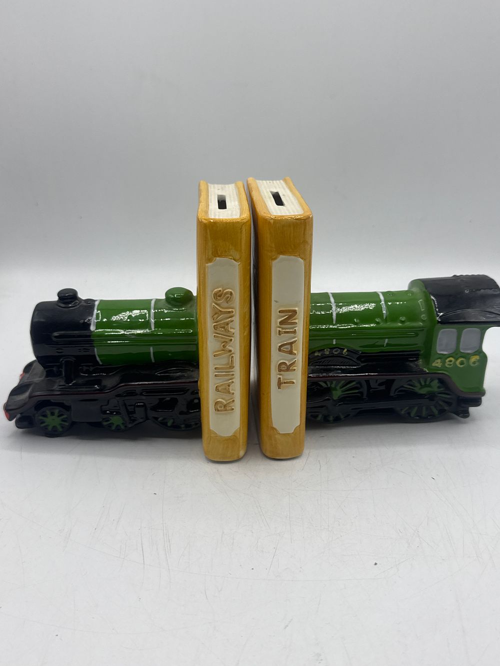 Lot 444: A Pair of Greenbrier International Flying Scotsman 4806 Ceramic Money Box Bookends