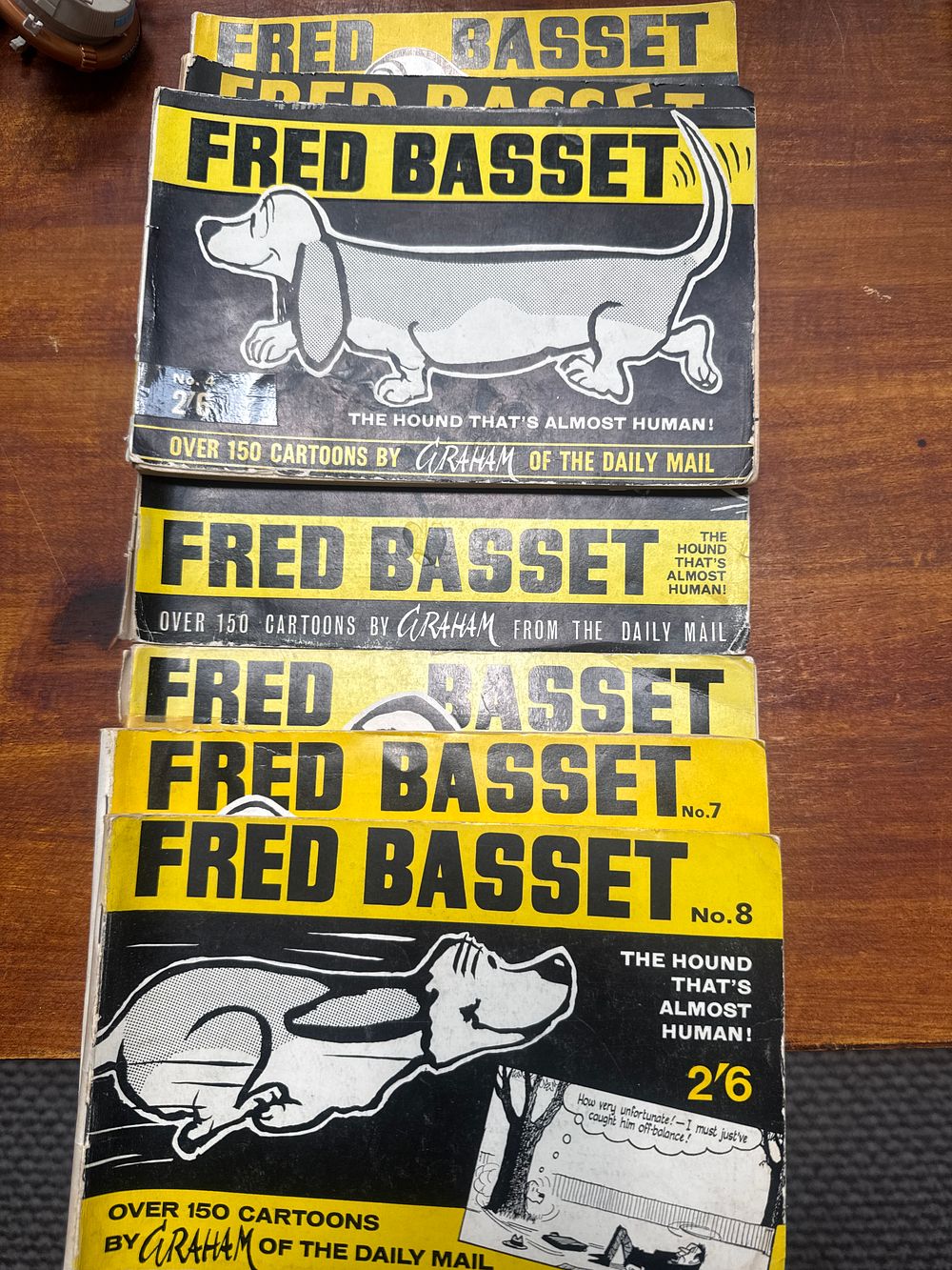 Lot 454: Seven Fred Basset Cartoon Books by Alex Graham