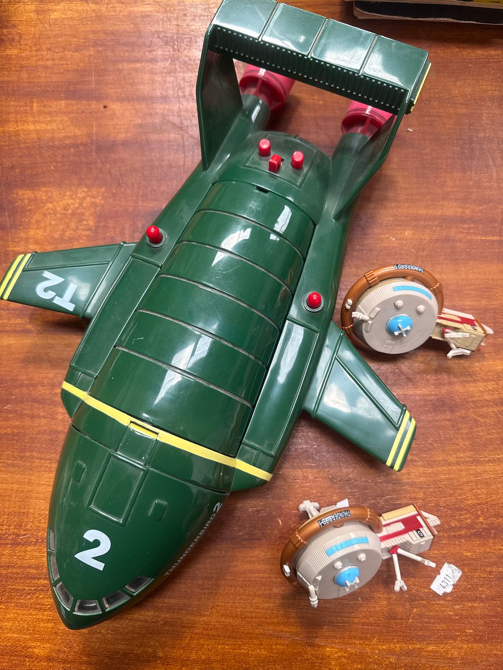 Lot 455: A Trio of Thunderbirds Toys Including a 16-inch Thunderbird 2 Rescue Carrier