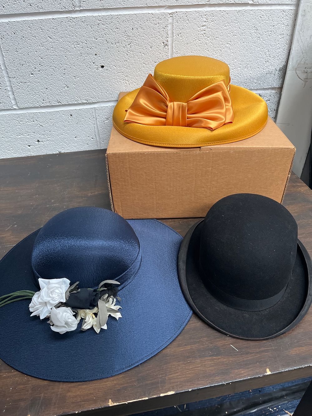 Lot 447: Three hats including a Tress & Co. London bowler and two ladies' formal hats