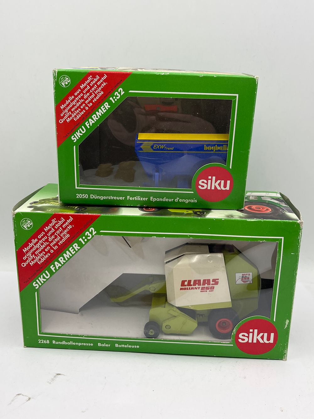 Lot 449: Two Siku Farmer 1:32 Scale Die-Cast Model Farm Implements