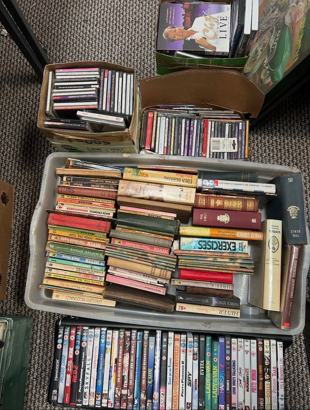 Lot 489: An Assortment of Books, Compact Discs, and DVDs