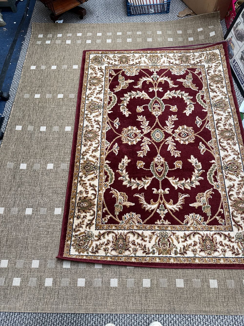 Lot 549: Two Machine-Made Area Rugs including a Red Floral Oriental Style Example