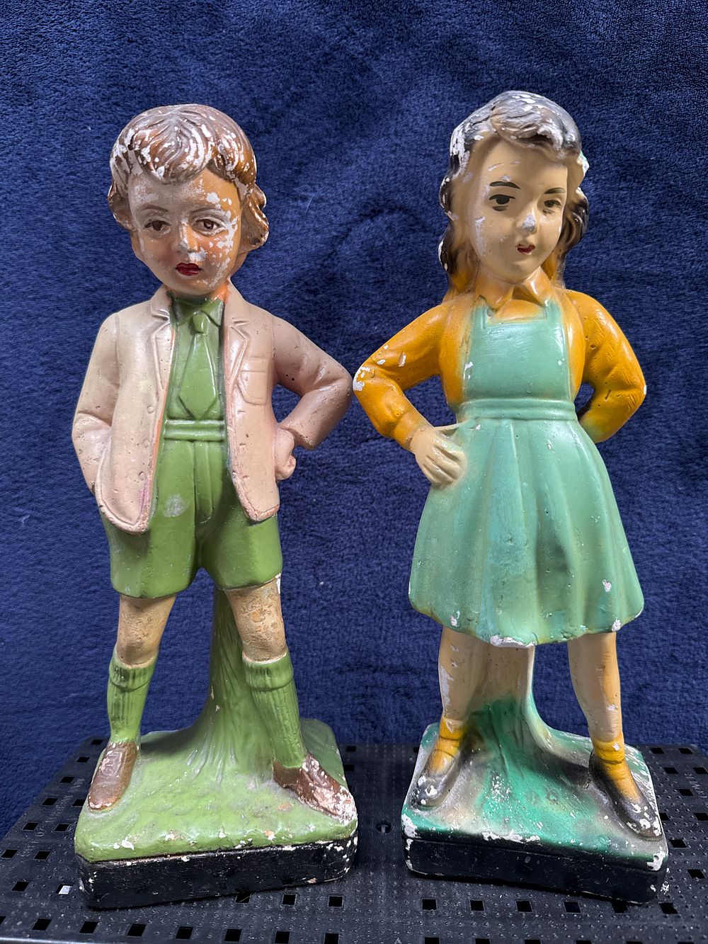 Lot 561: A Pair of Vintage Painted Chalkware Boy and Girl Figurines