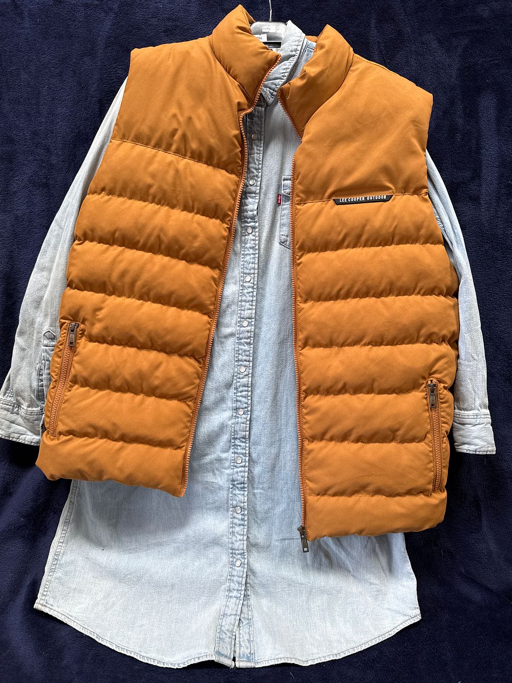 Lot 577: Two items of men's casual apparel comprising a Lee Cooper Outdoor puffer vest and a Levi's denim shirt