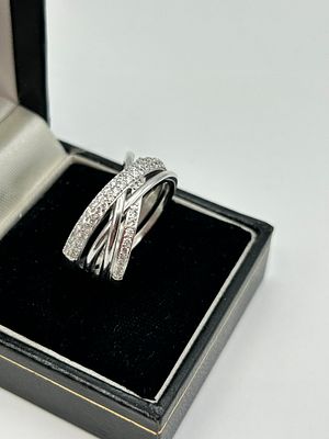 A Silver Sparkling and Polished Lines Crossover Ring