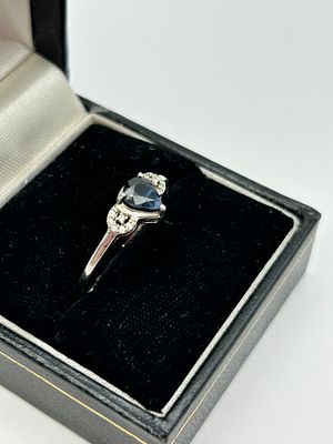 An Art Deco Style Silver Pear Cut Sapphire and Diamond Accent Ring
