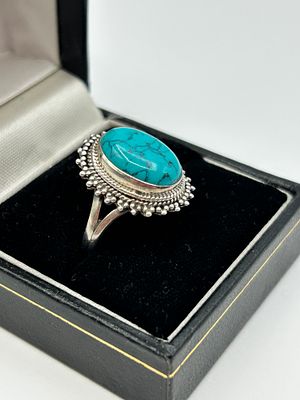 A Sterling Silver and Turquoise Navajo Style Cocktail Ring