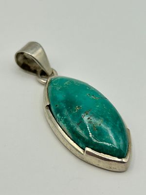 A Sterling Silver and Turquoise Cabochon Pendant