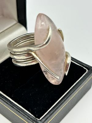 A modernist silver and rose quartz cocktail ring