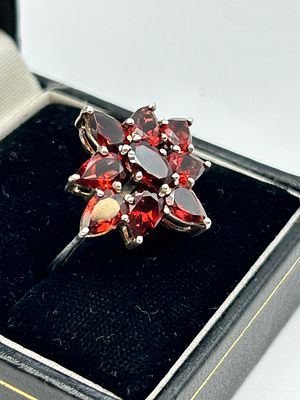 A Silver Garnet Flower Cluster Cocktail Ring