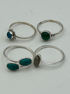 A Collection of 4 Silver and Gemstone Dress Rings