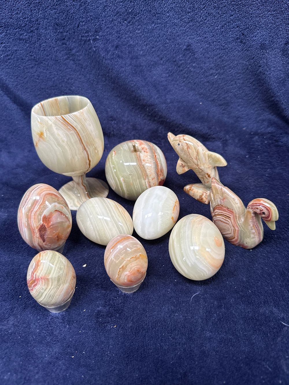 Lot 318: An Assortment of Carved and Polished Banded Onyx Decorative Objects