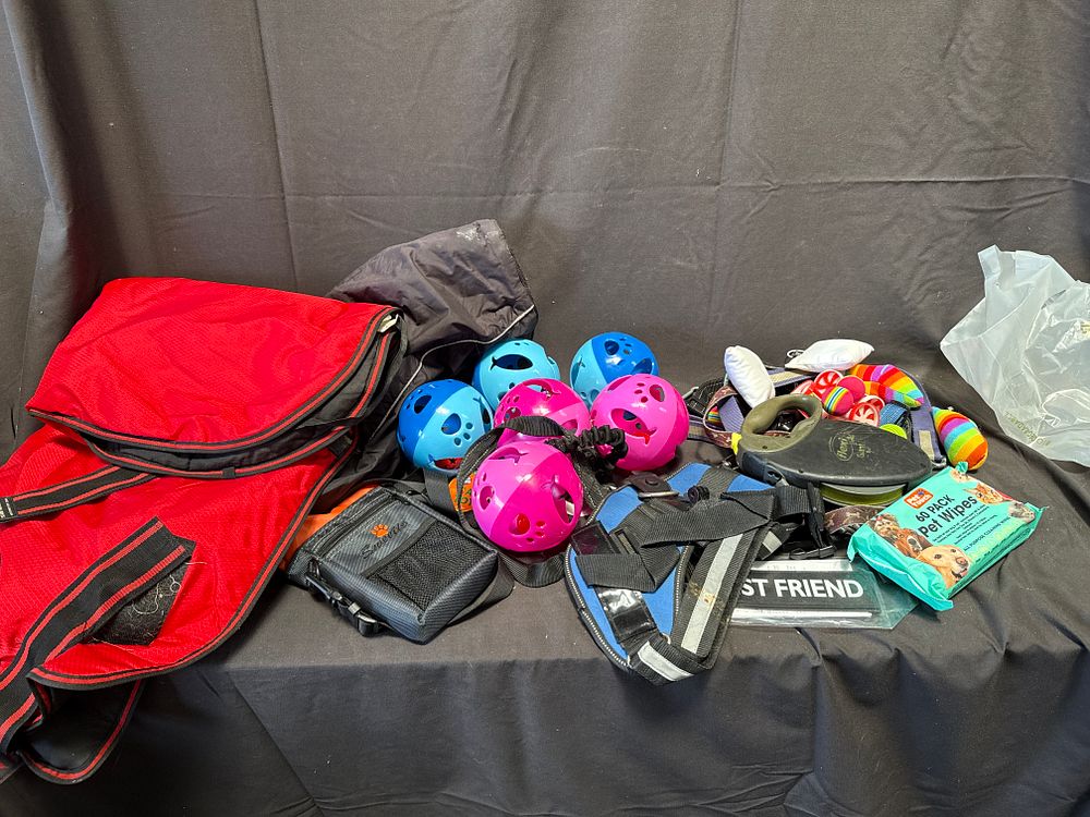 Lot 981: An Assortment of Pet Accessories including Dog Coats and a flexi Retractable Lead