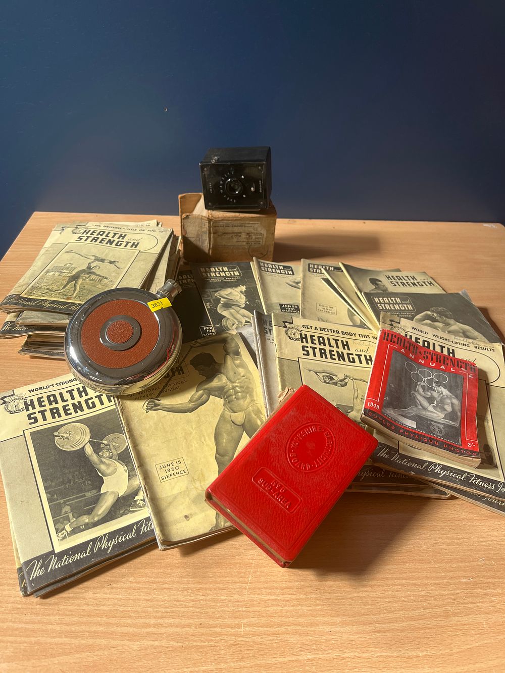Lot 991: A Collection of Vintage Health and Strength Magazines, a Kodak Baby Hawkeye Camera, and Miscellaneous Collectibles