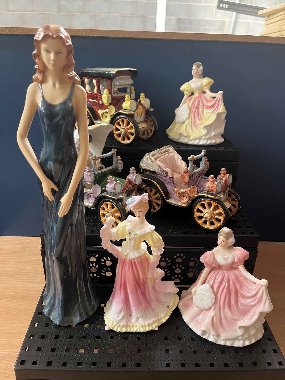 Lot 1028: A Collection of Seven Fine Bone China Figurines and Ceramic Vintage Vehicle Models