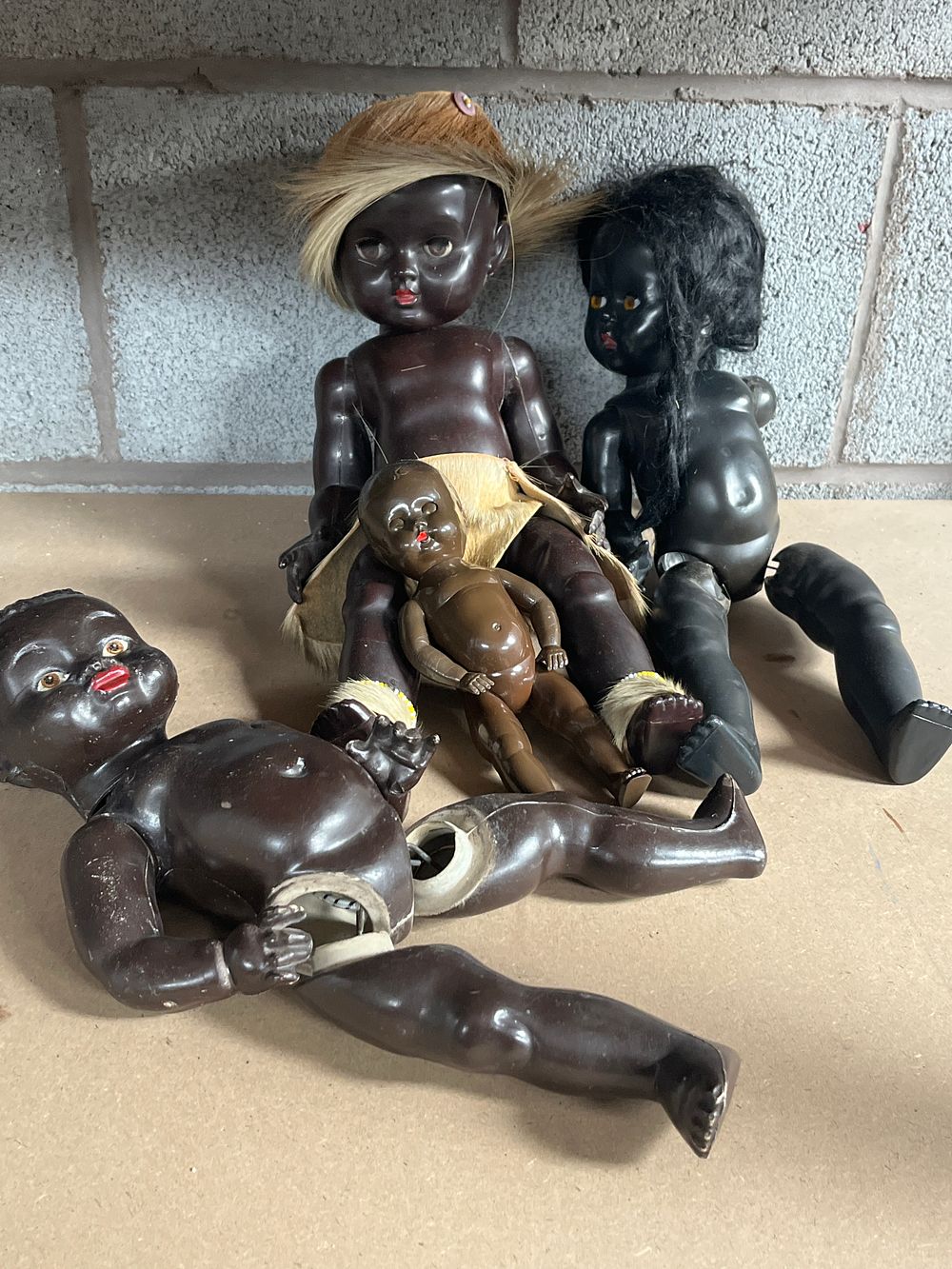 Lot 1066: A Collection of Five Vintage British Hard Plastic Black Dolls including Rosebud and Tudor Rose Examples