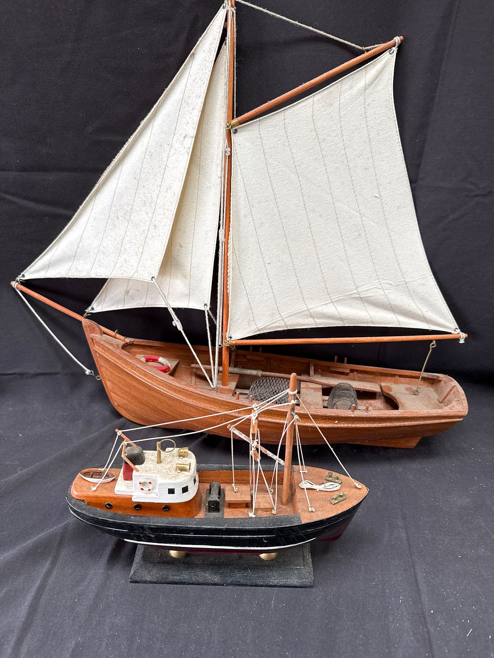 Lot 166: Two wooden maritime display models of a sailing lugger and a tugboat