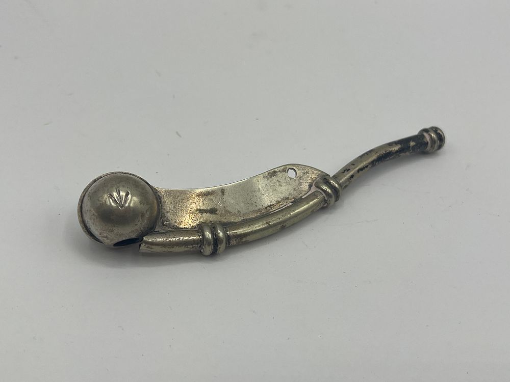 Lot 496: A British Royal Navy Silver-Plated Boatswain's Call with Broad Arrow Mark