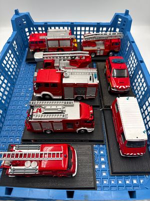 A Collection of Eight delPrado 1:64 Scale Die-Cast Fire and Emergency Vehicles. A collection of 