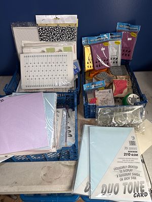 An Assortment of Crafting and Card-Making Supplies Including Stamps and Cardstock. A collection 