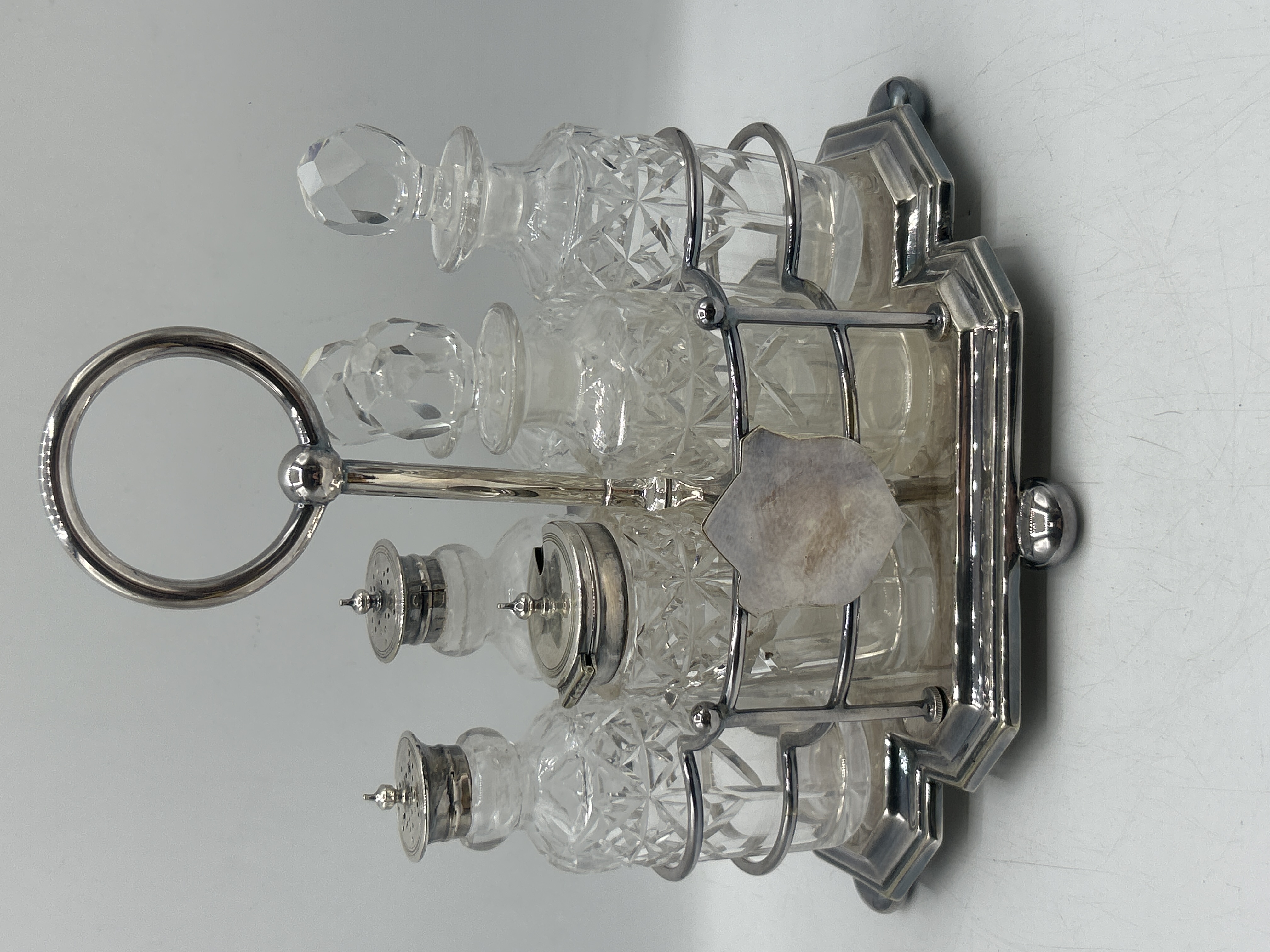 A Silver Plated and Cut Glass Cruet Set