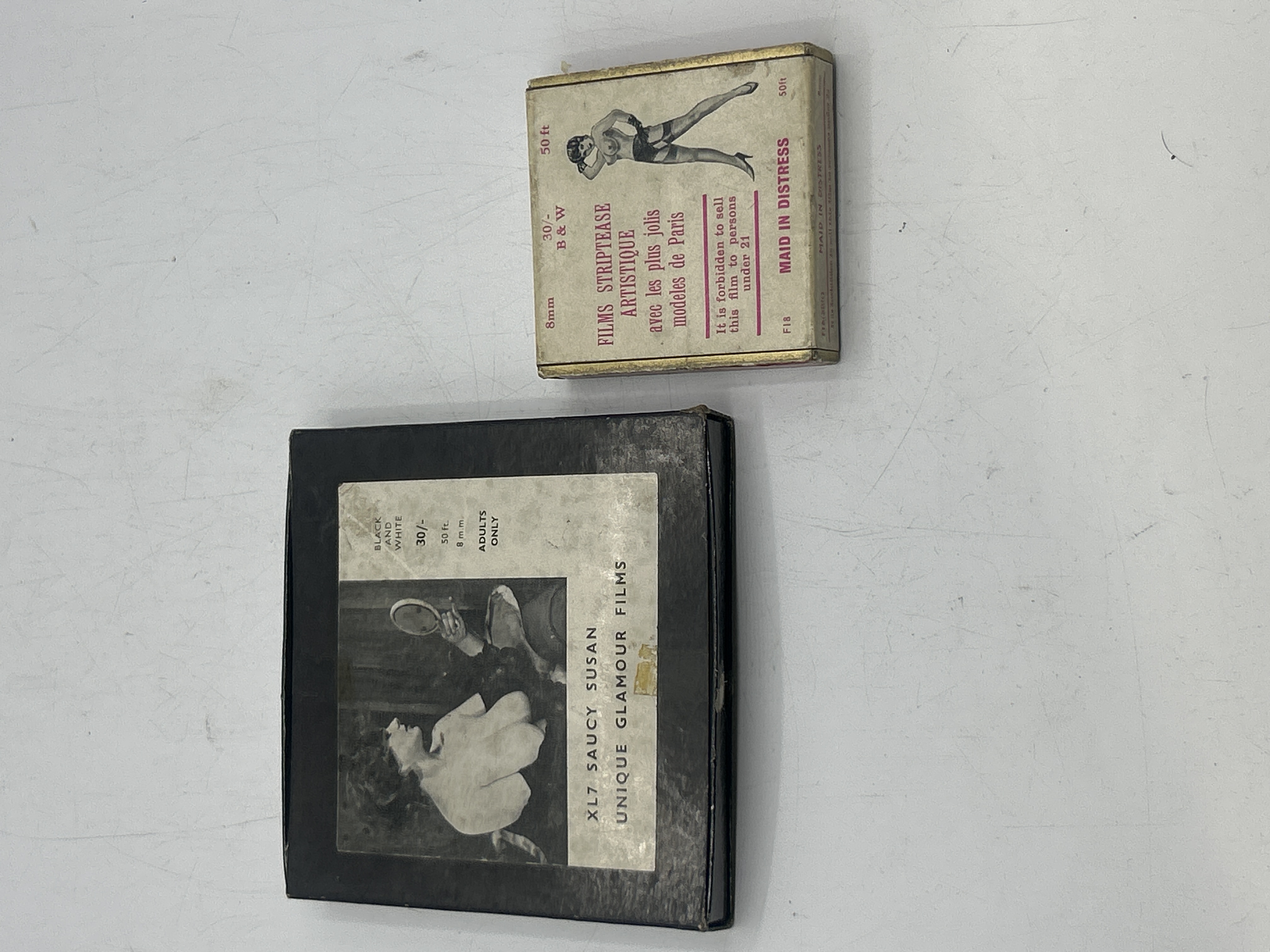 Two Vintage 8mm Glamour Film Boxes Saucy Susan and Maid in Distress